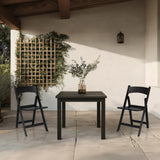 Two black TRAVANO 1 outdoor chairs with matching table on a terrace by hjh LIVING