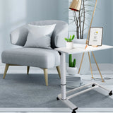White Standing desk STAND II on castors next to a grey armchair by hjh OFFICE