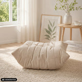 Beige Sitzolo Podi beanbag with quilted structure on a light-coloured rug by hjh LIVING (AI-generated image)