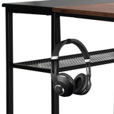 Headphones on the shelf of the WORKSPACE H I Office Desk in black-brown by hjh OFFICE
