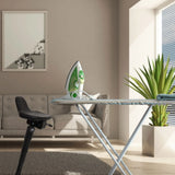 Black standing aid TOP WORK 34 next to an ironing board in a bright room by hjh OFFICE