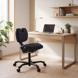 EvoShift kneeling chair in black at a light wood desk by hjh OFFICE