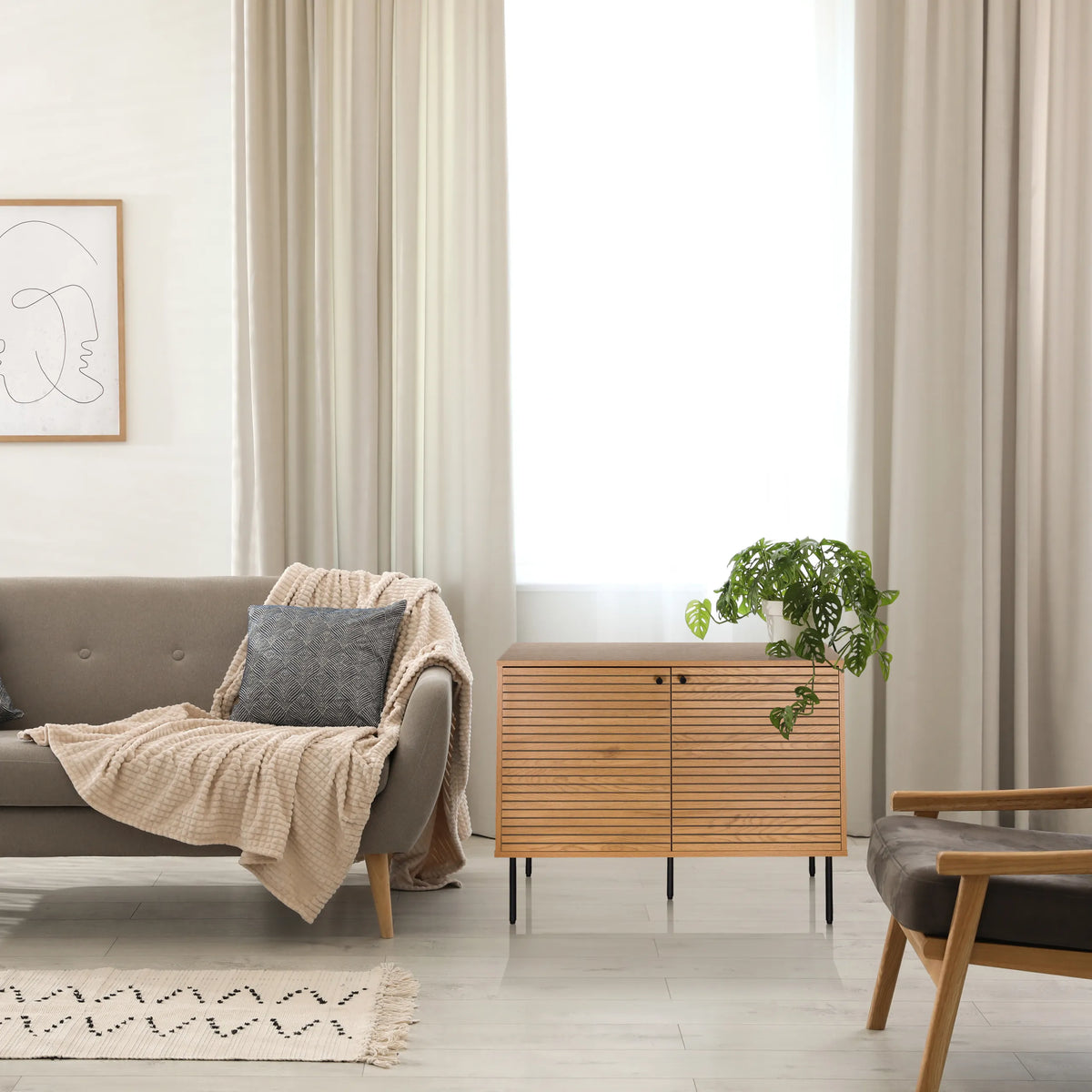 Sideboard LINNO S made of oak with ribbed fronts and black metal legs by hjh LIVING