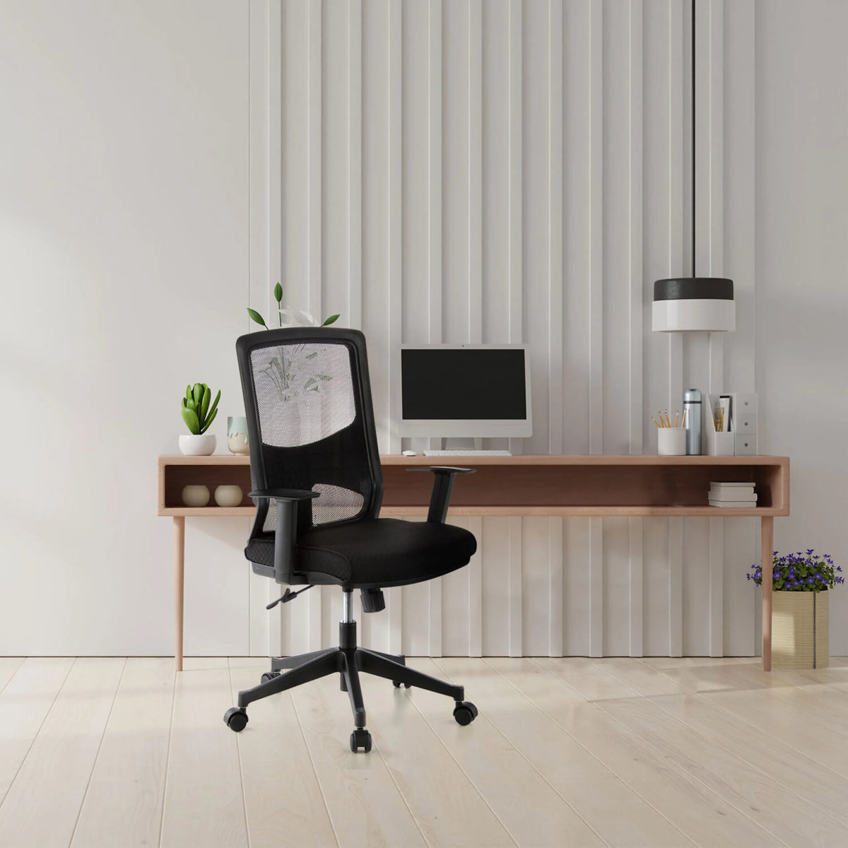 Black Professional Office Chair LAVITA with mesh backrest and armrests in front of a desk by hjh OFFICE