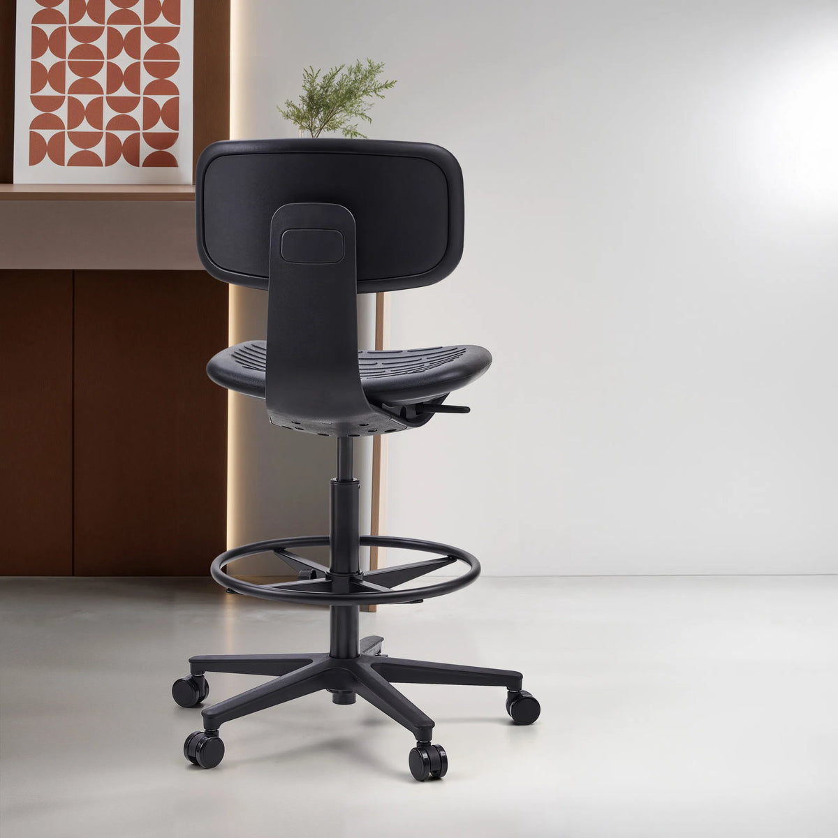 Rear view of the black Counter chair TOP WORK B with footrest and castors by hjh OFFICE