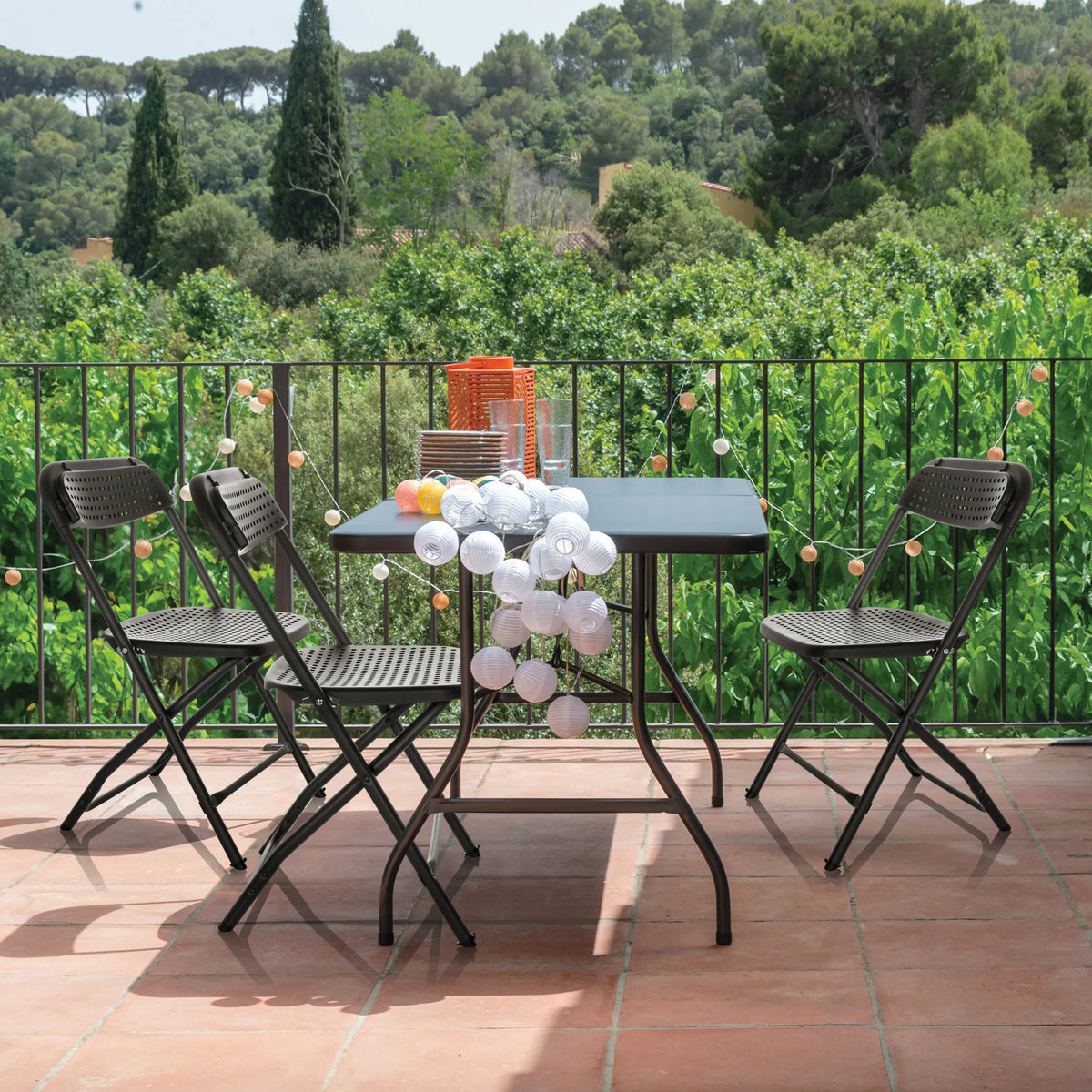Three black Outdoor chairs TUDELA XXL PRO with a matching table on a terrace by hjh OFFICE