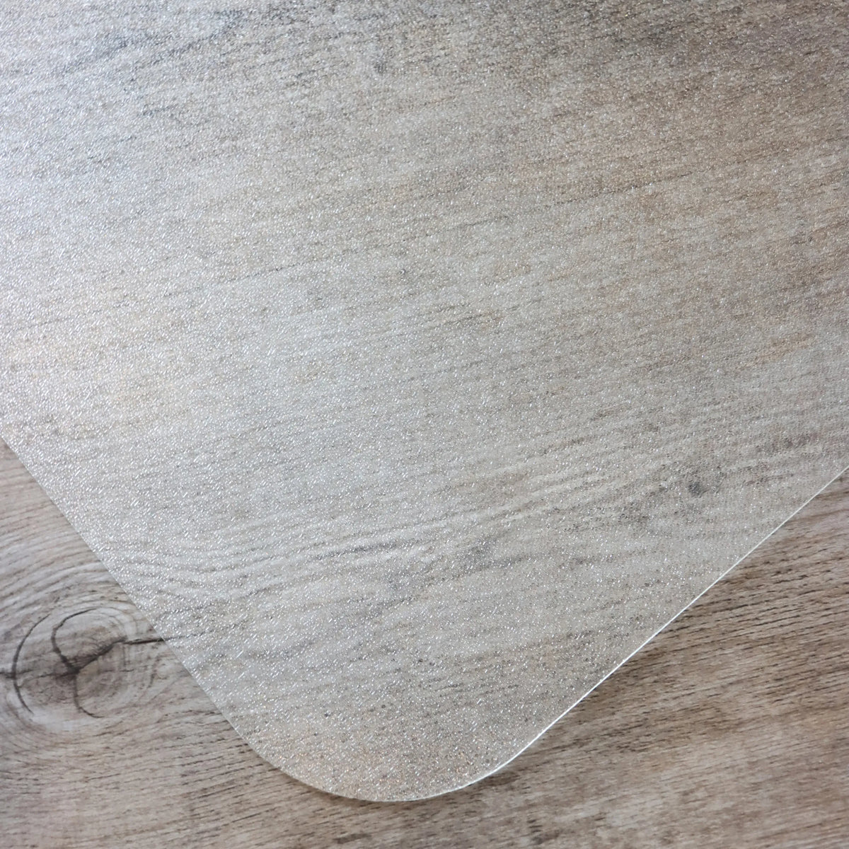 Transparent surface of the PUNOMAT office mat for hard floors by Kottig