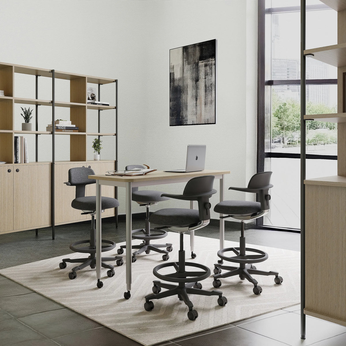 Four dark grey TOP WORK 40 work chairs with armrests and footrings at a white desk by hjh OFFICE