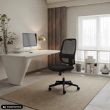 Black Professional Office Chair Minoro B with mesh backrest in a bright home office by hjh OFFICE (AI-generated image)