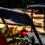 Perforated backrest of the TUDELA XXL PRO outdoor chair in black by hjh OFFICE