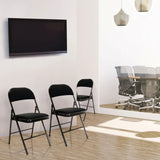 Three black TUDELA II folding chairs with fabric cover in a room by hjh OFFICE