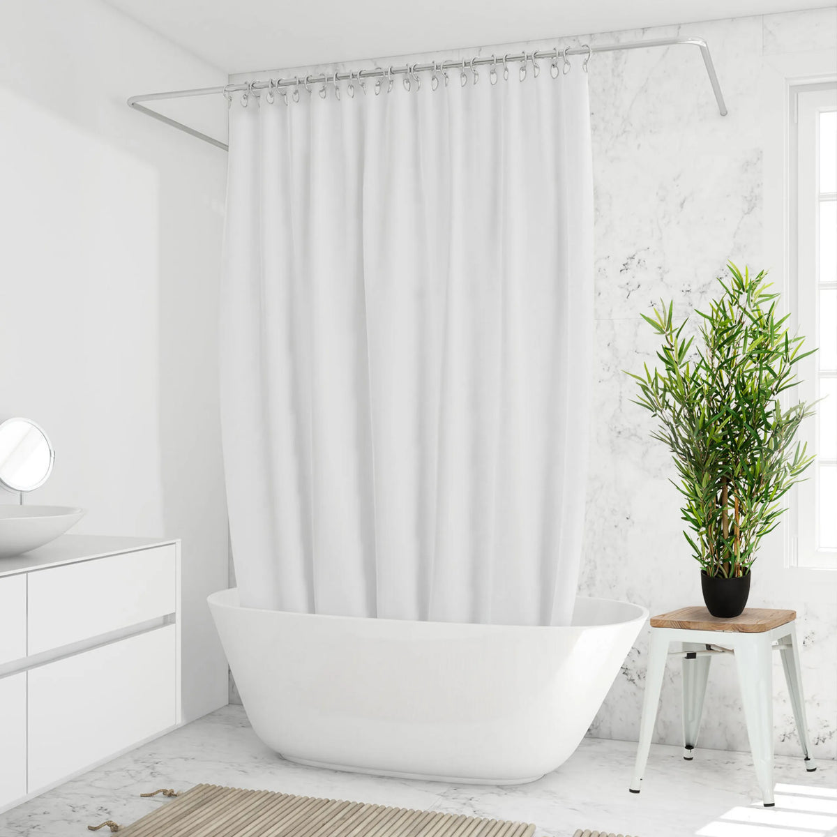 Green artificial plant MINI BAMBUS in a black pot on a white stool by hjh OFFICE