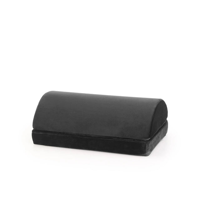 Black Footrest Podi Velvet 1 with a padded, semi-circular surface by hjh OFFICE