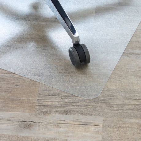 Transparent Office Mat PUNOMAT for hard floors with an office chair caster by Kottig